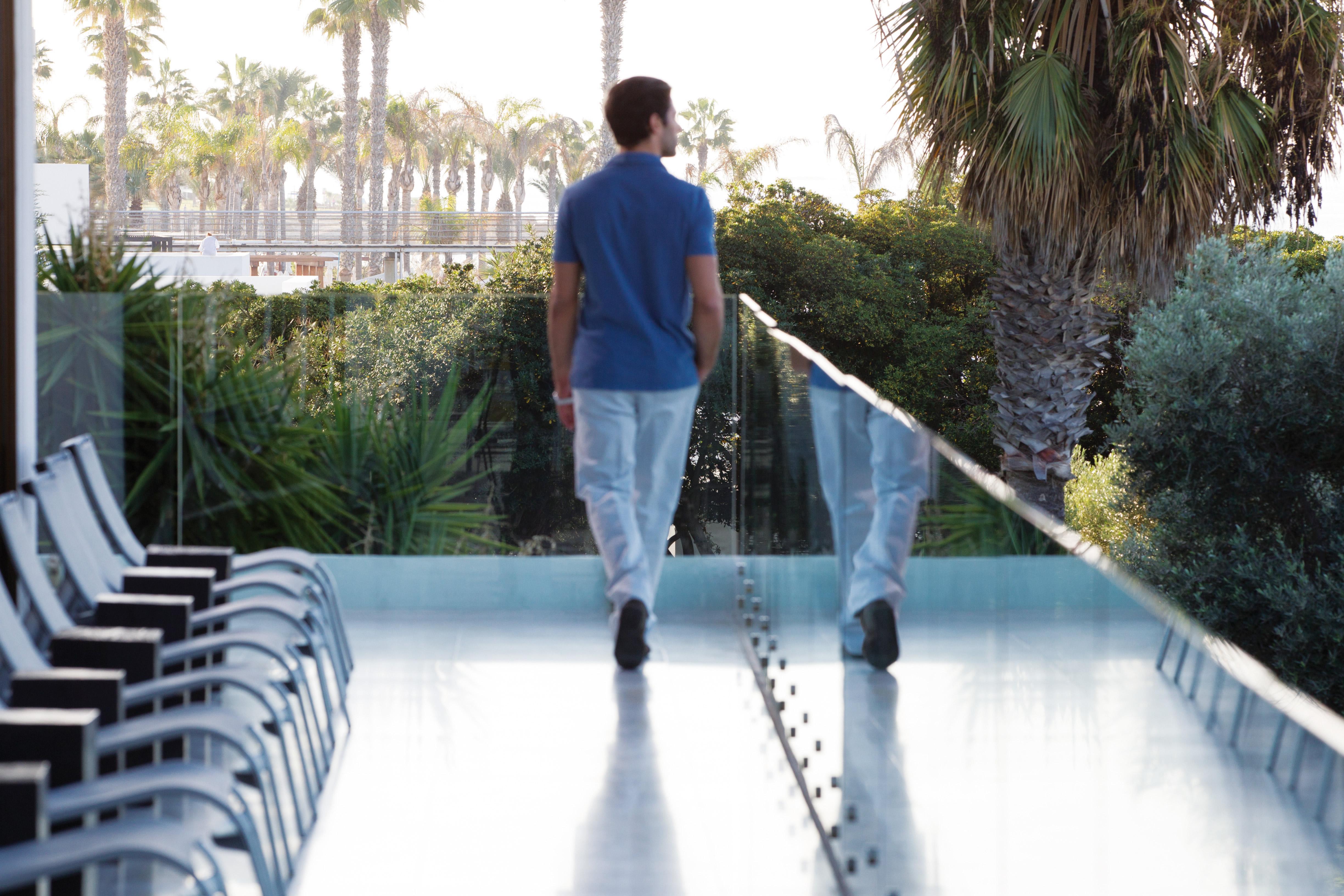Almyra Hotel Paphos Kültér fotó A man walking