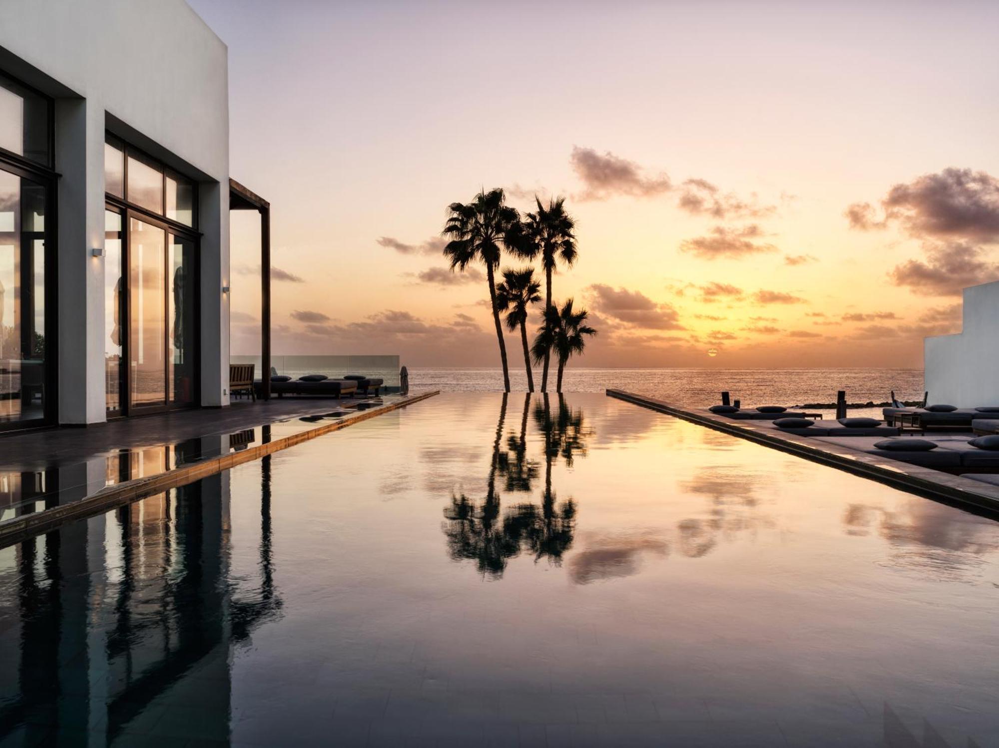 Almyra Hotel Paphos Kültér fotó Sunset at the St Regis Maldives
